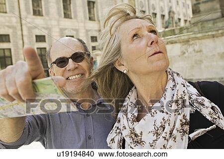 Stock Image - Older couple using city map. Fotosearch