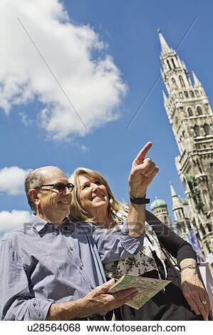 Older couple using city map View Large Photo Image Stock Photo - Older couple using city map. Fotosearch