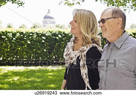 Older couple walking hand-in-hand View Large Photo Image Stock Image - Older couple walking hand-in-hand. Fotosearch