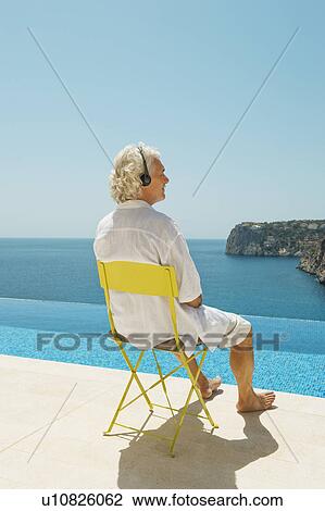 Older man overlooking Dragonera Island View Large Photo Image Stock Image - Older man overlooking Dragonera Island. Fotosearch