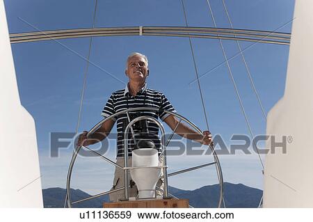 Stock Photo - Older man sailing. Fotosearch