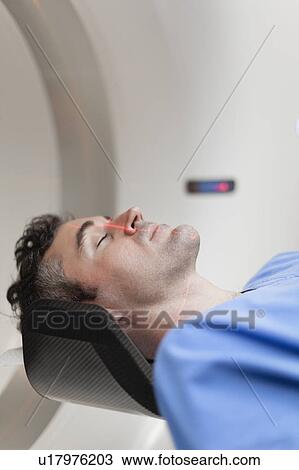 Patient laying in CT scanner in hospital View Large Photo Image Stock Image - Patient laying in CT scanner in hospital. Fotosearch