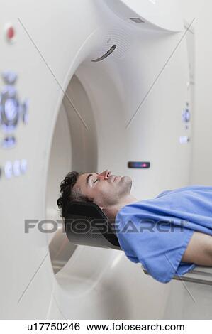 Patient laying in CT scanner in hospital View Large Photo Image Stock Photograph - Patient laying in CT scanner in hospital. Fotosearch