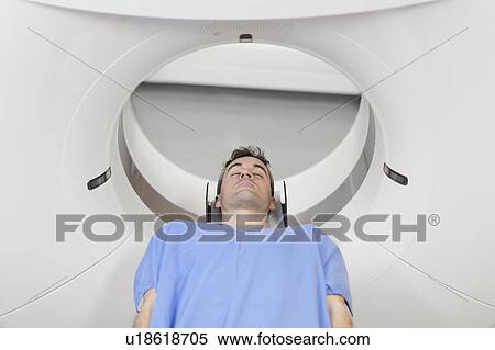 Patient laying in CT scanner in hospital View Large Photo Image Stock Photography - Patient laying in CT scanner in hospital. Fotosearch