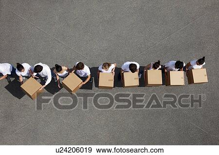 People passing cardboard boxes View Large Photo Image Stock Photo - People passing cardboard boxes. Fotosearch