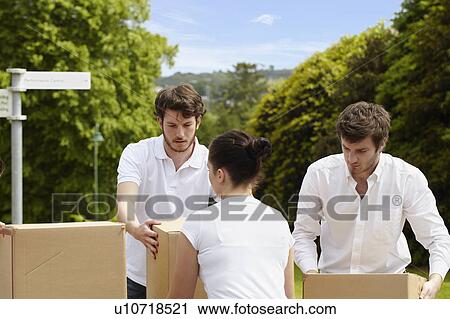 People stacking cardboard boxes View Large Photo Image Stock Image - People stacking cardboard boxes. Fotosearch