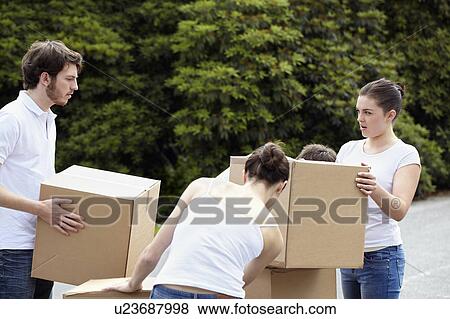 People stacking cardboard boxes View Large Photo Image Stock Photo - People stacking cardboard boxes. Fotosearch