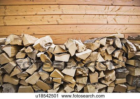 Piles of chopped wood outside house View Large Photo Image Stock Image - Piles of chopped wood outside house. Fotosearch