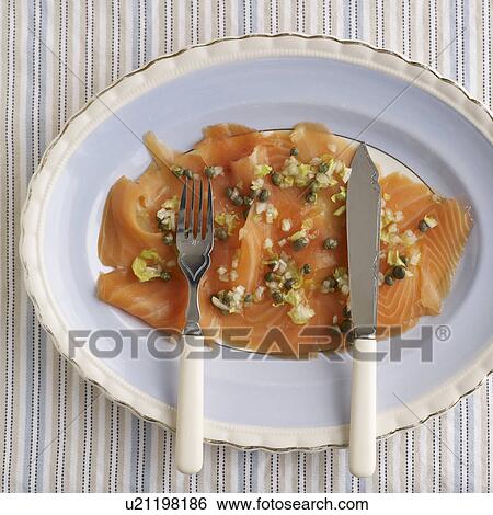 Stock Photograph - Plate of smoked salmon with capers. Fotosearch