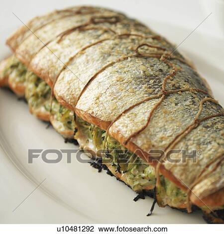 Stock Image - Roasted salmon with bean salsa. Fotosearch