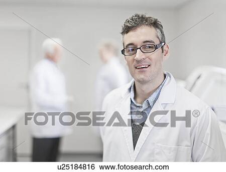 Stock Photograph - Scientist standing in pathology lab. Fotosearch