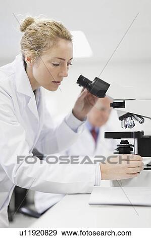Stock Photo - Scientist working in pathology lab. Fotosearch