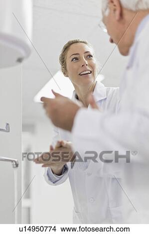 Scientists talking in pathology lab View Large Photo Image Picture - Scientists talking in pathology lab. Fotosearch