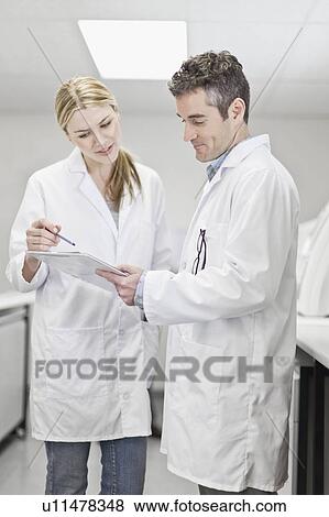 Scientists talking in pathology lab View Large Photo Image Stock Photo - Scientists talking in pathology lab. Fotosearch