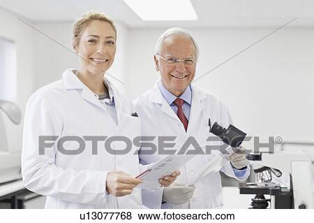 Scientists talking in pathology lab View Large Photo Image Stock Photo - Scientists talking in pathology lab. Fotosearch