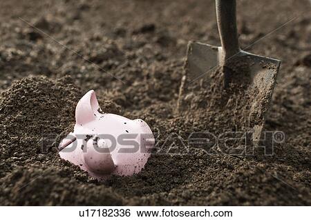 Shovel digging up piggy bank View Large Photo Image Stock Photograph - Shovel digging up piggy bank. Fotosearch