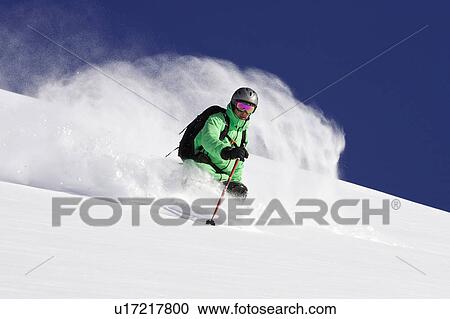 Skier on snowy mountain slope View Large Photo Image Stock Image - Skier on snowy mountain slope. Fotosearch
