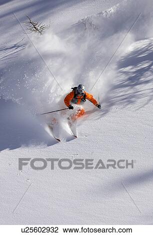 Skier on snowy mountain slope View Large Photo Image Stock Image - Skier on snowy mountain slope. Fotosearch
