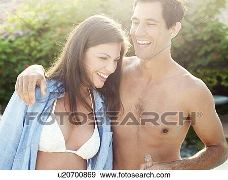 Smiling couple hugging outdoors View Large Photo Image Stock Photo - Smiling couple hugging outdoors. Fotosearch