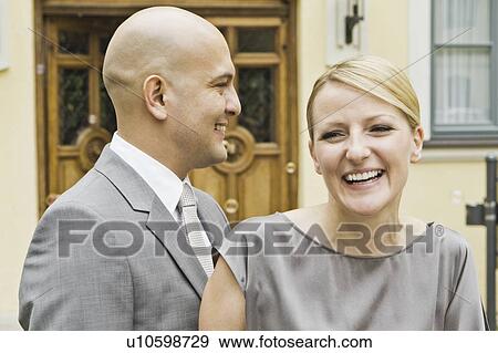 Stock Photo - Smiling couple walking together. Fotosearch