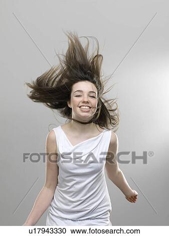 Smiling girl jumping for joy View Large Photo Image Stock Image - Smiling girl jumping for joy. Fotosearch