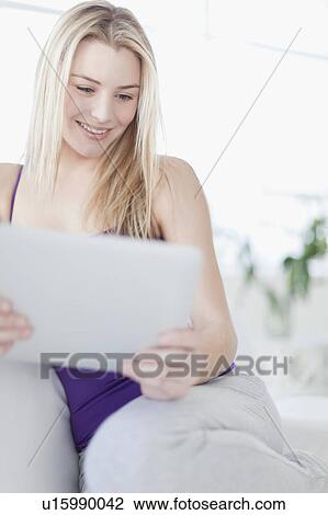Smiling teenage girl using tablet View Large Photo Image Stock Image - Smiling teenage girl using tablet. Fotosearch