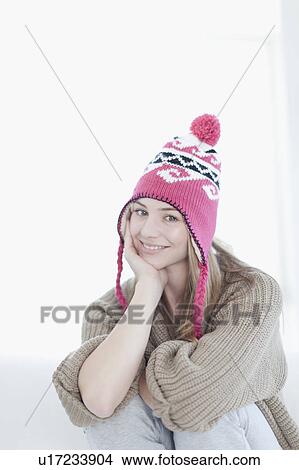 Smiling teenage girl wearing knitted hat View Large Photo Image Picture - Smiling teenage girl wearing knitted hat. Fotosearch