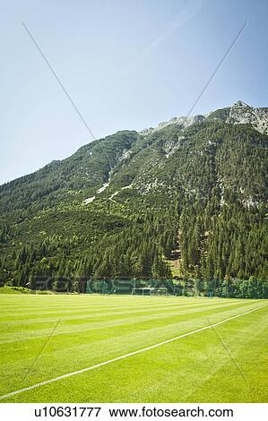 Stock Photo - Sports field in rural landscape. Fotosearch
