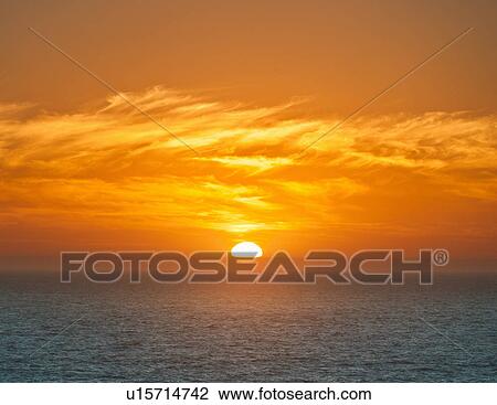 Sun setting over horizon View Large Photo Image Stock Image - Sun setting over horizon. Fotosearch