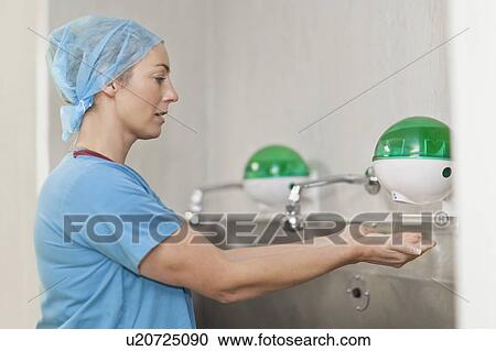 Surgeon washing hands before operation View Large Photo Image Stock Image - Surgeon washing hands before operation. Fotosearch