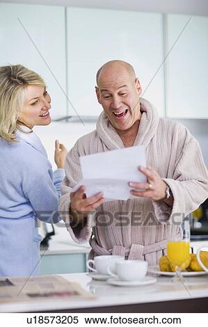 Surprised man reading mail View Large Photo Image Stock Photography - Surprised man reading mail. Fotosearch