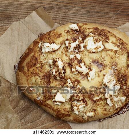 Sweet goat cheese tart on cutting board View Large Photo Image Stock Photography - Sweet goat cheese tart on cutting board. Fotosearch