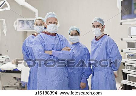 Team of doctors in operating room View Large Photo Image Picture - Team of doctors in operating room. Fotosearch