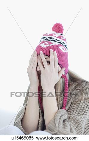 Stock Photography - Teenage girl covering face with hands. Fotosearch