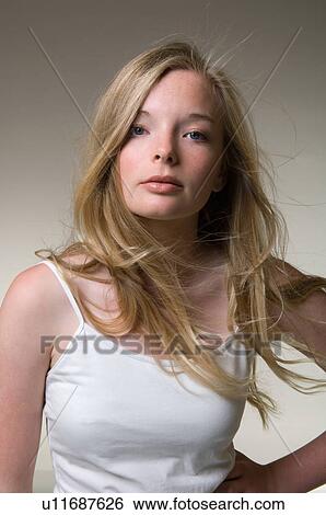 Teenage girl standing with hand on hip View Large Photo Image Stock Photograph - Teenage girl standing with hand on hip. Fotosearch