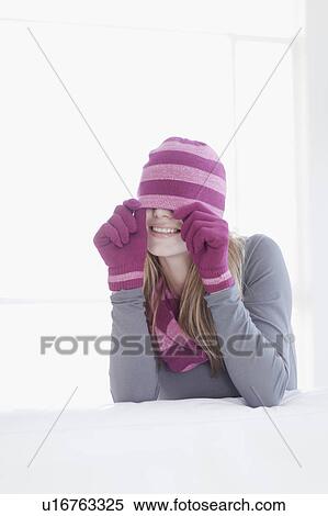 Stock Photography - Teenage girl wearing hat and gloves. Fotosearch