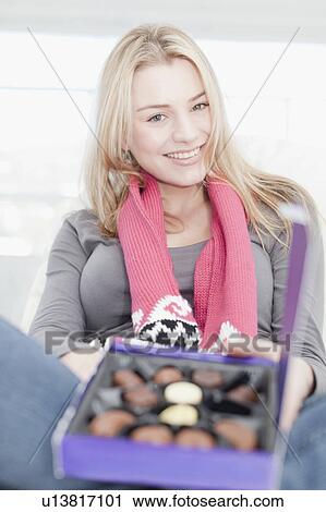 Teenage girl with box of chocolates View Large Photo Image Stock Image - Teenage girl with box of chocolates. Fotosearch