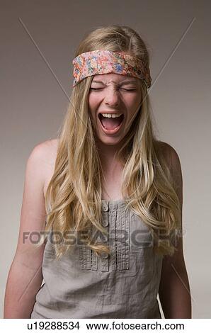 Picture - Teenage girl yelling. Fotosearch