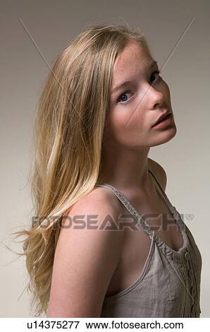 Stock Photo - Teenage girl’s hair blowing in wind. Fotosearch