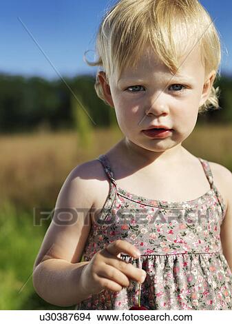 Toddler girl standing outdoors View Large Photo Image Picture - Toddler girl standing outdoors. Fotosearch