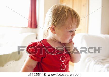 Toddler girl walking in living room View Large Photo Image Stock Photo - Toddler girl walking in living room. Fotosearch