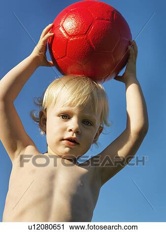 Toddler playing with red ball outdoors View Large Photo Image Stock Image - Toddler playing with red ball outdoors. Fotosearch