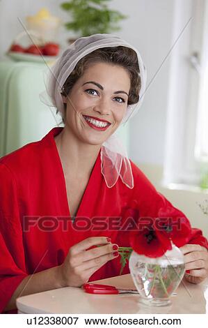 Woman arranging flowers in vase View Large Photo Image Stock Photo - Woman arranging flowers in vase. Fotosearch