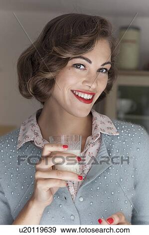 Woman drinking glass of milk View Large Photo Image Stock Photo - Woman drinking glass of milk. Fotosearch