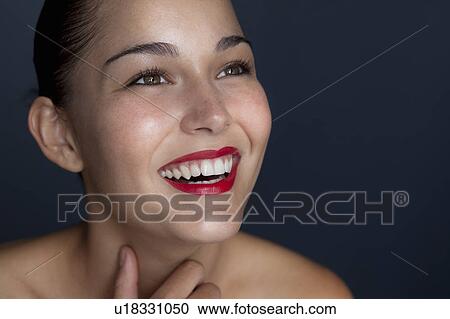 Woman holding halved pomegranate View Large Photo Image Stock Image - Woman holding halved pomegranate. Fotosearch