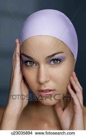 Picture - Woman in swim cap with makeup on. Fotosearch