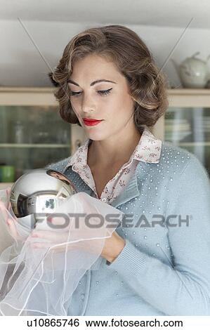 Woman polishing mirrored ball View Large Photo Image Stock Photograph - Woman polishing mirrored ball. Fotosearch