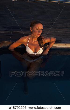 Woman relaxing in swimming pool View Large Photo Image Stock Photograph - Woman relaxing in swimming pool. Fotosearch