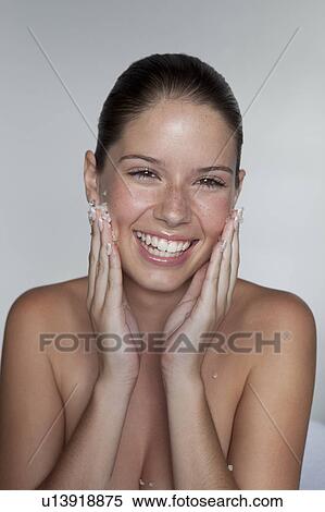 Woman scrubbing sugar on her face View Large Photo Image Stock Photography - Woman scrubbing sugar on her face. Fotosearch