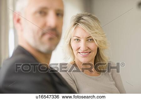 Woman smiling with husband View Large Photo Image Stock Photograph - Woman smiling with husband. Fotosearch